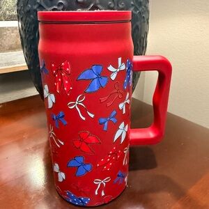 Brand New. Never used. 50oz Insulated Hydro Red Mug with Bow Design